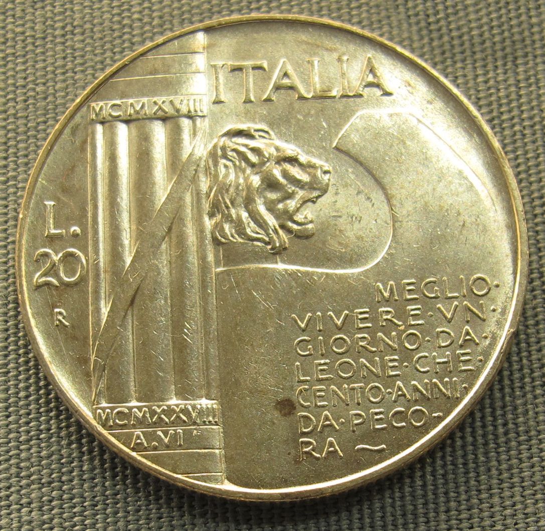 Fotografie einer Goldmünze. Darauf ist ein Loewenkopf abgebildet und in Großbuchstaben "Italia"
